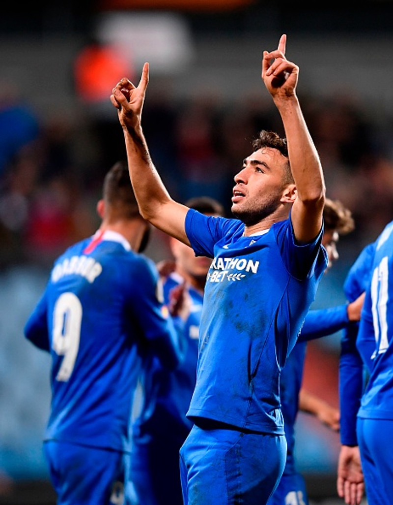 Munir gerði þrennu fyrir Sevilla sem tryggði sig í 32-liða úrslitin.