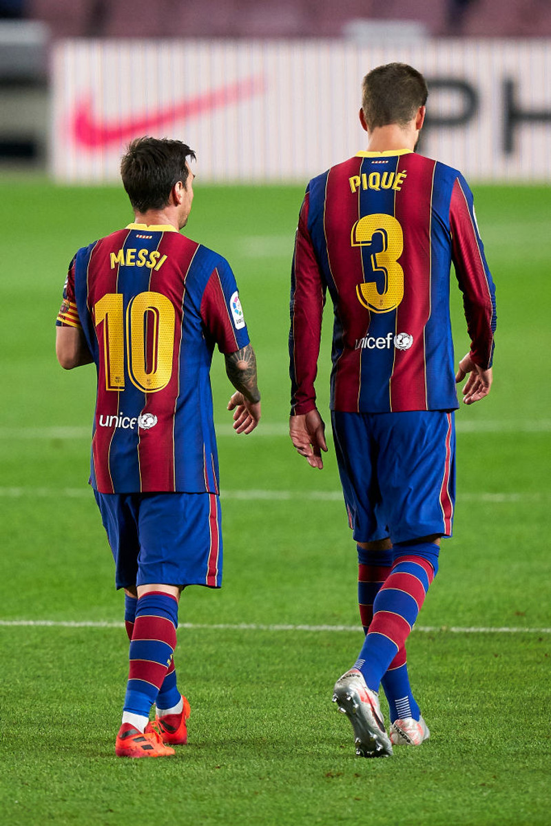 Gerard Pique og Lionel Messi