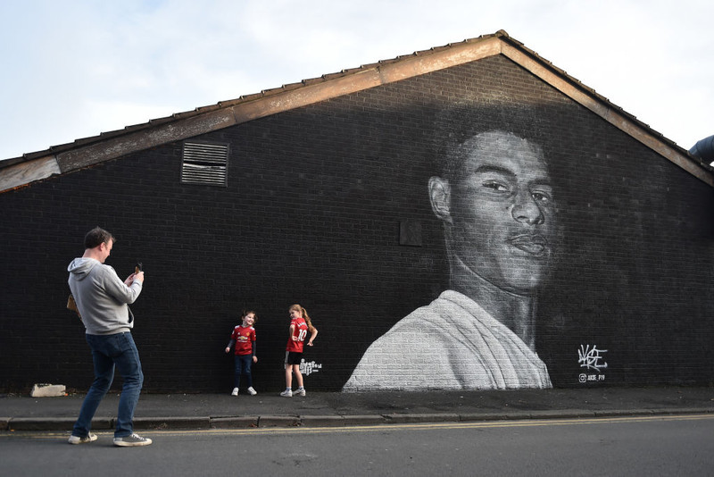 Mynd af Rashforf á húsvegg í Manchester.