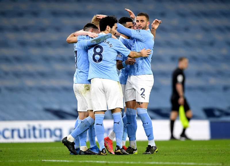 Manchester City fer í bikarúrslit samkvæmt spánni.