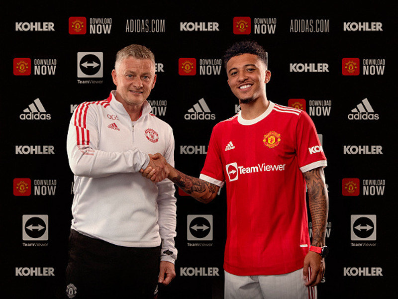 Ole Gunnar Solskjær, stjóri United, með Sancho.