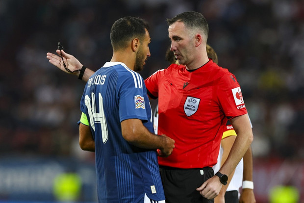 Vangelis Pavlidis of Greece (L) and referee Chris Kavanagh